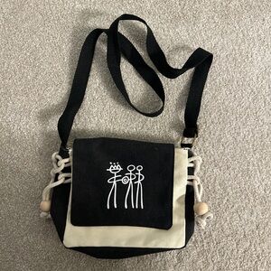 Unique tan and black crossbody bag